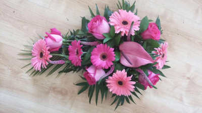 Single Ended Pink Spray - Beautiful tribute in lovely shades of pink with dark green foliage to compliment. Includes local delivery.