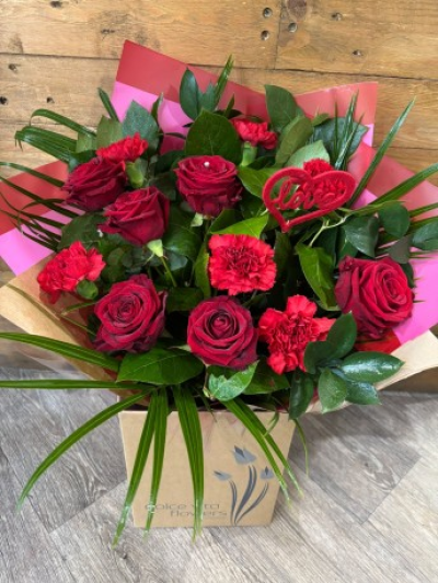 Red Roses and Carnations - Dozen carnations and roses make the perfect couple when combined in this timeless and romantic gift thats sure to impress.