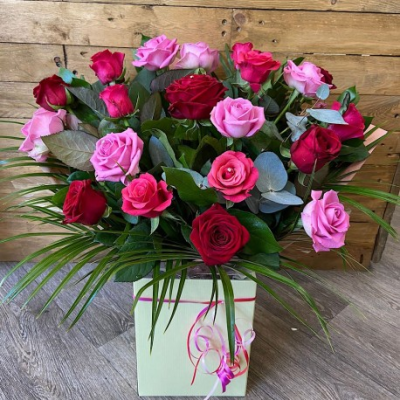 Red and Pink Rose Bouquet - This will be a beautiful bouquet created by one of our talented florists and include a mix of fresh red and pink roses with a variety of foliage and presented in one of our boxes with food and water for longer lasting stems. Our aim is to make the bouquet as close as possible to the picture but this depends on availability.

Standard is 12 roses

Deluxe is 18 roses

Luxury is 24 roses